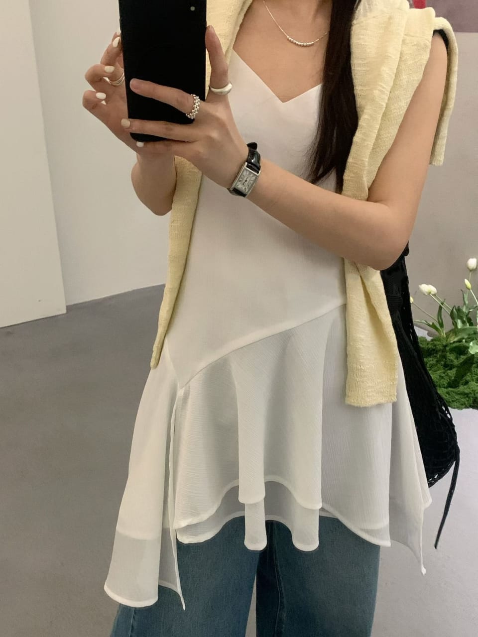White slip dress - close-up outfit detail with asymmetric hem
