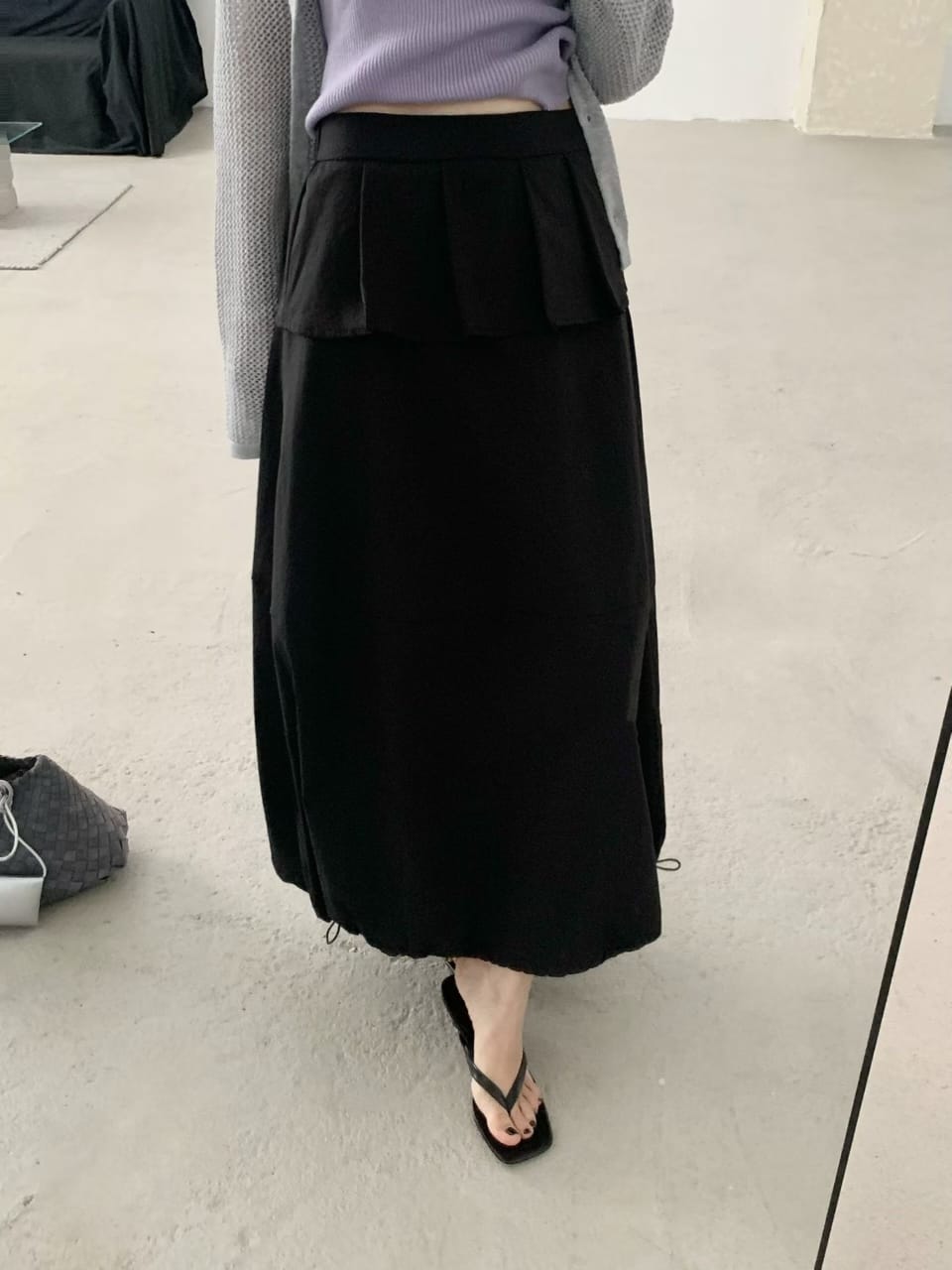 White skirt worn with knit cardigan