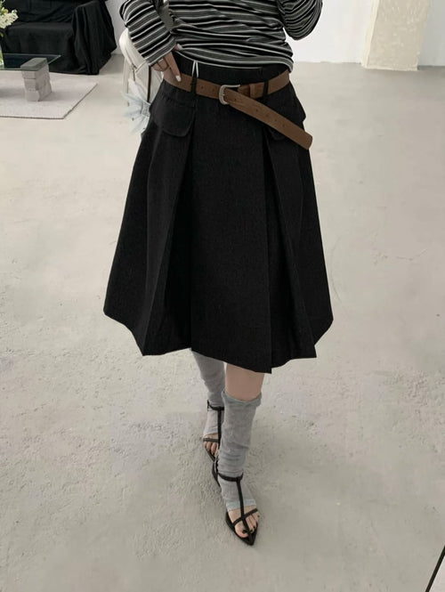 Black belted pleated mini skirt worn front view