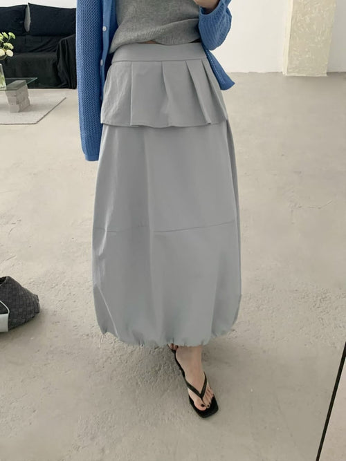 White skirt worn with knit top side view