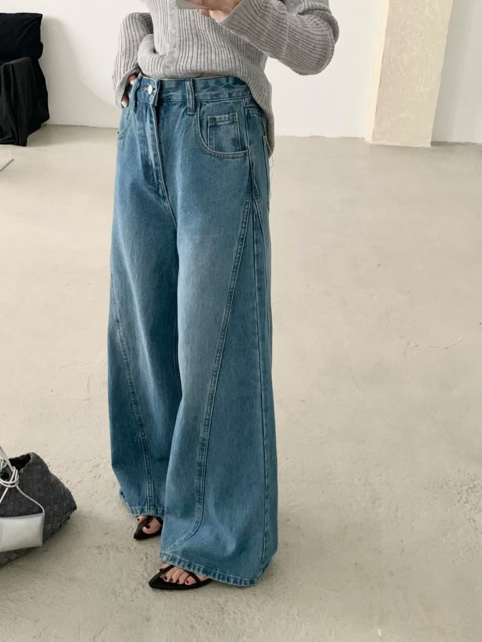 Wide-leg jeans worn with grey knit